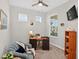 Comfortable office space with a desk, chair, bookcase, and a large window at 6051 Sw 93Rd Cir, Ocala, FL 34481