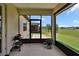 Cozy screened patio with a peaceful view of the green lawn, ideal for outdoor dining or lounging at 6051 Sw 93Rd Cir, Ocala, FL 34481