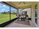 Relaxing screened patio with comfortable rocking chairs, perfect for enjoying the outdoors year-round at 6051 Sw 93Rd Cir, Ocala, FL 34481