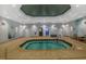 Indoor spa with neutral walls, tile floor, and multiple entry/exit points at 6051 Sw 93Rd Cir, Ocala, FL 34481