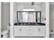 Spacious bathroom features double vanity, a large mirror, and a walk-in shower at 7210 Sw 179 Ct, Dunnellon, FL 34432