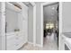 Open closet leading to a view of the eat-in kitchen, offering seamless storage and access to culinary spaces at 7210 Sw 179 Ct, Dunnellon, FL 34432