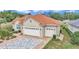 Lovely home featuring a red tile roof, three-car garage, and meticulously landscaped grounds at 7210 Sw 179 Ct, Dunnellon, FL 34432