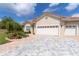 Beautiful home featuring a red tile roof, three-car garage, and professionally landscaped front yard at 7210 Sw 179 Ct, Dunnellon, FL 34432
