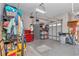 Functional garage with storage shelves and tools, offering ample space for projects at 7210 Sw 179 Ct, Dunnellon, FL 34432
