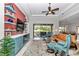Comfortable living room with blue accents and patio access at 7210 Sw 179 Ct, Dunnellon, FL 34432
