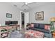 Cozy room with a stylish sofa, ottoman, and desk providing a comfortable and functional living space at 7210 Sw 179 Ct, Dunnellon, FL 34432