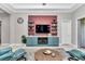 Cozy living room featuring a custom entertainment center and neutral color palette at 7210 Sw 179 Ct, Dunnellon, FL 34432