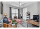 Inviting living room featuring stylish furnishings, neutral walls, and a bright window with lots of natural light at 7210 Sw 179 Ct, Dunnellon, FL 34432
