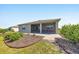 Spacious backyard featuring stone pathway and covered patio at 7750 Sw 87Th Ave, Ocala, FL 34481