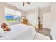 Charming bedroom showcasing a wooden bed, bright window, and closet at 7750 Sw 87Th Ave, Ocala, FL 34481