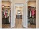 Walk-in closets offer a seamless transition to the bathroom area with ample space for storage at 7750 Sw 87Th Ave, Ocala, FL 34481
