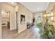 Charming entryway with decorative front door, hall bench, and access to the bathroom at 7750 Sw 87Th Ave, Ocala, FL 34481