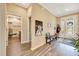 Inviting entryway with decorative front door, hall bench, and access to a bathroom at 7750 Sw 87Th Ave, Ocala, FL 34481