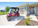 Golf cart parked in front of home on large driveway at 7750 Sw 87Th Ave, Ocala, FL 34481