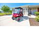 Golf cart parked in front of home on large driveway at 7750 Sw 87Th Ave, Ocala, FL 34481