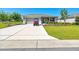 Charming single-story home with well-manicured lawn and golf cart at 7750 Sw 87Th Ave, Ocala, FL 34481