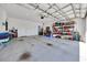 Spacious two-car garage with ample storage space and concrete flooring at 7750 Sw 87Th Ave, Ocala, FL 34481