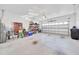 Large garage with storage and bright lighting at 7750 Sw 87Th Ave, Ocala, FL 34481