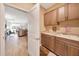 Convenient laundry room with granite countertops, ample cabinet storage, and a sink at 7750 Sw 87Th Ave, Ocala, FL 34481