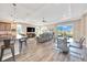 An open concept living space featuring a spacious living area, dining area, and kitchen at 7750 Sw 87Th Ave, Ocala, FL 34481