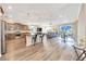 Spacious open floor plan with modern kitchen, island with stools, and dining area at 7750 Sw 87Th Ave, Ocala, FL 34481