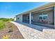 Paver walkway leading to covered patio with cozy seating at 7750 Sw 87Th Ave, Ocala, FL 34481