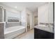 This bathroom features a soaking tub and granite counters at 8110 Sw 59Th Ter, Ocala, FL 34476