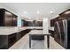 A spacious kitchen features dark cabinets, granite countertops, stainless steel appliances, and a large center island at 8110 Sw 59Th Ter, Ocala, FL 34476