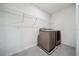 A laundry room featuring a modern washer and dryer with wire shelving above for organized storage at 8110 Sw 59Th Ter, Ocala, FL 34476