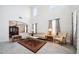 Bright living room with high ceilings, tile floors, elegant decor, and chandelier at 8110 Sw 59Th Ter, Ocala, FL 34476