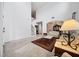 Bright living room with high ceilings, tile floors, elegant decor, and arched doorway at 8110 Sw 59Th Ter, Ocala, FL 34476