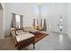 Bright living room with high ceilings, tile floors, elegant decor, and large windows at 8110 Sw 59Th Ter, Ocala, FL 34476