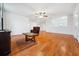 Bright living room with wood floors, ceiling fan, and neutral walls offers a cozy ambiance at 8110 Sw 59Th Ter, Ocala, FL 34476