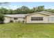 A well-maintained lawn highlights the backyard of this cozy home, offering privacy at 8745 Sw 92Nd St # B, Ocala, FL 34481