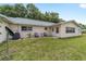 A charming home boasts a spacious backyard with an area for outdoor seating at 8745 Sw 92Nd St # B, Ocala, FL 34481