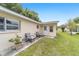 Backyard area with seating and a door entrance, great for relaxation and outdoor dining at 8745 Sw 92Nd St # B, Ocala, FL 34481