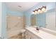 Bathroom featuring bath tub, updated vanity, and a matching mirror at 8745 Sw 92Nd St # B, Ocala, FL 34481