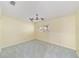 Bright bedroom features a ceiling fan, neutral carpet, and a window with plantation shutters at 8745 Sw 92Nd St # B, Ocala, FL 34481