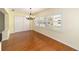 Dining room with hardwood floors and plantation shutters at 8745 Sw 92Nd St # B, Ocala, FL 34481