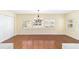 Dining room with hardwood floors and plantation shutters at 8745 Sw 92Nd St # B, Ocala, FL 34481