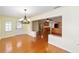 Dining room overlooking the kitchen with hardwood floors at 8745 Sw 92Nd St # B, Ocala, FL 34481