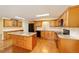 Well-equipped kitchen features an island, granite countertops, and modern appliances at 8745 Sw 92Nd St # B, Ocala, FL 34481
