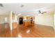 Spacious kitchen featuring hardwood floors, island, and modern appliances at 8745 Sw 92Nd St # B, Ocala, FL 34481