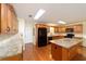 Well-equipped kitchen features an island, granite countertops, and modern appliances at 8745 Sw 92Nd St # B, Ocala, FL 34481