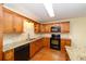 Gourmet kitchen with granite countertops, modern appliances, and ample cabinet space at 8745 Sw 92Nd St # B, Ocala, FL 34481