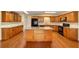 Well-equipped kitchen features an island, granite countertops, and modern appliances at 8745 Sw 92Nd St # B, Ocala, FL 34481