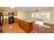 Open kitchen with island and modern appliances flows into the living area at 8745 Sw 92Nd St # B, Ocala, FL 34481