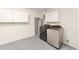 Laundry area with modern washer, dryer, and ample storage cabinets for convenience at 8745 Sw 92Nd St # B, Ocala, FL 34481