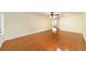 Spacious open-concept living room featuring hardwood floors, neutral walls, and natural light at 8745 Sw 92Nd St # B, Ocala, FL 34481